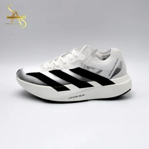 The Adidas Adizero Adios Pro EVO 1 stands as a groundbreaking achievement in the world of running footwear, redefining what’s possible in speed and performance. Engineered for elite athletes and serious runners, this shoe represents Adidas’ lightest-ever marathon racing model, weighing an astonishingly minimal amount that allows for maximum efficiency with every stride. Crafted with innovation at its core, it features a revolutionary Lightstrike Pro foam midsole, providing exceptional energy return and responsive cushioning without unnecessary weight. The design eliminates excess layers, ensuring only the most essential materials are used to enhance speed. Its carbon-infused ENERGYRODS 2.0 system delivers dynamic propulsion, helping runners maintain stability and forward momentum through long-distance runs. The outsole is designed with precision grip, offering dependable traction even under high-speed conditions, making it ideal for both road and race environments. Visually, the Adizero Adios Pro EVO 1 carries a sleek and minimalist aesthetic that mirrors its cutting-edge performance. The upper is composed of an ultra-thin, translucent mesh that enhances breathability while reducing drag. This focus on lightness and efficiency allows runners to feel closer to the ground, enabling a more natural yet explosive running motion. Every detail of the Adizero Adios Pro EVO 1 serves one purpose: to break barriers in marathon performance. It’s not just a shoe—it’s a symbol of Adidas’ relentless pursuit of innovation, speed, and the future of competitive running.
