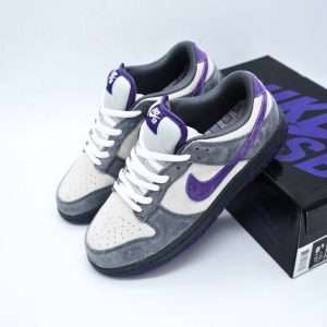 The Nike SB Dunk Low Purple Pigeon is a sneaker that blends rare street culture influence with timeless skate-ready performance. Originally inspired by the iconic Dunk lineup, this edition stands out with its unmistakable colorway. The shoe features a cool-toned grey base layered with bold purple accents across the Swoosh, outsole, and branding details. This contrast gives the Purple Pigeon a sleek yet distinctive identity—easily recognizable for sneaker enthusiasts and casual wearers alike.