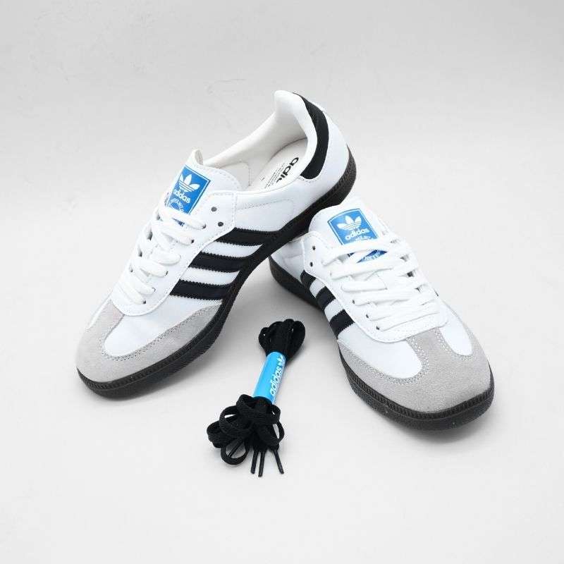 The Adidas Samba stands as one of the most legendary and timeless sneakers ever created, combining vintage charm with modern lifestyle appeal. Originally designed as an indoor soccer shoe, the Samba has evolved far beyond the sports world and become an essential style icon across generations. Its signature low-top silhouette, clean lines, and minimalistic design create a refined look that pairs effortlessly with any outfit—whether you prefer casual streetwear, athletic fits, or even something slightly more polished. The smooth leather upper and suede toe cap not only enhance durability but also add a textured contrast that elevates its visual appeal.