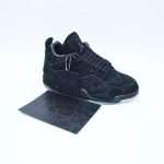 The Nike Air Jordan 4 Retro KAWS is a highly coveted collaboration that blends iconic street art aesthetics with one of the most celebrated silhouettes in sneaker history. This unique release brings together the craftsmanship of Jordan Brand and the creative vision of the renowned artist KAWS, resulting in a premium sneaker that feels both artistic and timeless. The shoe features a luxurious suede upper in a monochromatic tone, creating a smooth and refined look that immediately sets it apart. Subtle stitching details and carefully crafted paneling highlight the classic structure of the Air Jordan 4, while maintaining the elevated feel of a limited-edition collaboration.