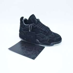 The Nike Air Jordan 4 Retro KAWS is a highly coveted collaboration that blends iconic street art aesthetics with one of the most celebrated silhouettes in sneaker history. This unique release brings together the craftsmanship of Jordan Brand and the creative vision of the renowned artist KAWS, resulting in a premium sneaker that feels both artistic and timeless. The shoe features a luxurious suede upper in a monochromatic tone, creating a smooth and refined look that immediately sets it apart. Subtle stitching details and carefully crafted paneling highlight the classic structure of the Air Jordan 4, while maintaining the elevated feel of a limited-edition collaboration.