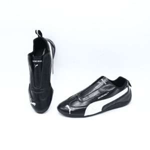 The Balenciaga x Puma Speedcat Leather Black is a stunning fusion of motorsport heritage and high-fashion craftsmanship. Designed for those who appreciate minimalist detailing wrapped in luxury, this sneaker elevates a classic silhouette into something truly iconic. Its sleek profile and low-cut shape are inspired by race-driving shoes, ensuring an aerodynamic look that hugs the foot naturally. The upper is constructed from premium black leather, offering a soft yet durable feel that stands the test of time. Every stitch contributes to a luxurious aesthetic, while maintaining the comfort and flexibility needed for everyday movement.