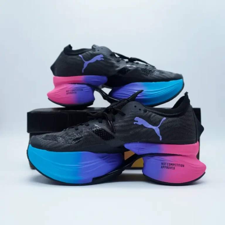 The Puma Fast-R Nitro Elite “Sunset” is a striking blend of advanced performance technology and vibrant aesthetics, designed for serious runners who demand both speed and style. Drawing inspiration from the warm hues of the evening sky, this colorway combines radiant oranges, deep purples, and fiery reds that fade seamlessly into one another, mirroring the captivating tones of a setting sun. It’s not just visually stunning — it’s built to perform at the highest level.