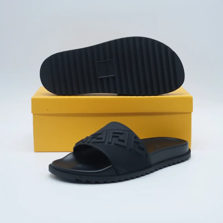 Experience effortless luxury and everyday comfort with the Fendi Rubber Black Slides, a modern essential crafted for those who appreciate both style and functionality. These slides feature a sleek all-black design that reflects Fendi’s signature minimal aesthetic while still making a bold statement. Made from high-quality, durable rubber, they are designed to withstand daily wear whether you’re heading to the beach, running quick errands, or relaxing outdoors.